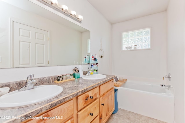 2939 Jon Hall Rd, Grand Junction, CO 81503 - full bath featuring a bath, double vanity, and tile patterned floors
