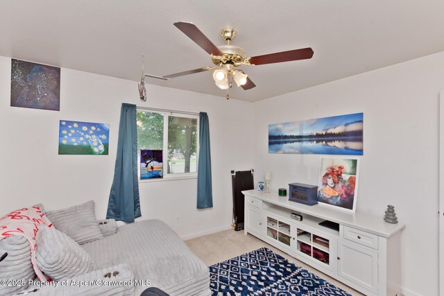 2939 Jon Hall Rd, Grand Junction, CO 81503 - living room featuring light carpet, ceiling fan, and baseboards