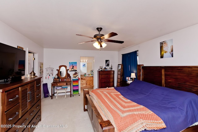 2939 Jon Hall Rd, Grand Junction, CO 81503 - bedroom featuring light colored carpet, connected bathroom, and ceiling fan