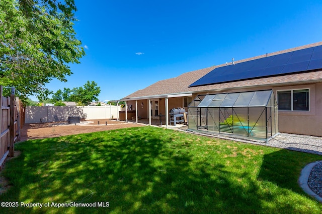 2939 Jon Hall Rd, Grand Junction, CO 81503 - view of yard featuring an exterior structure, a patio, and an outbuilding