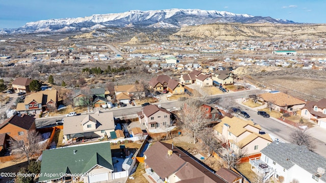drone / aerial view with a residential view and a mountain view