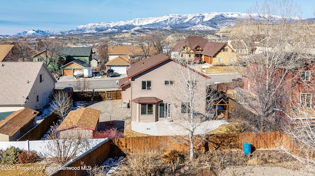 drone / aerial view featuring a residential view and a mountain view