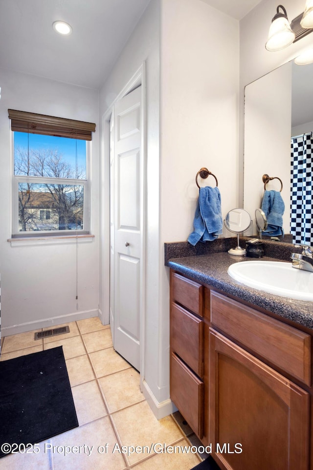 bathroom with tile patterned floors, recessed lighting, visible vents, and vanity