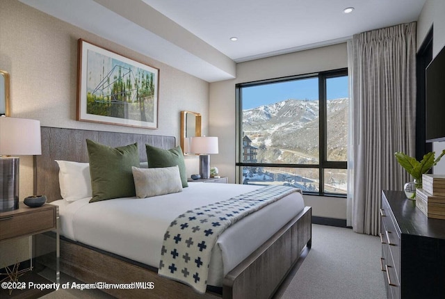 77 Wood Rd Unit 507-10, Snowmass Village, CO 81615 - bedroom with a mountain view, recessed lighting, and light carpet