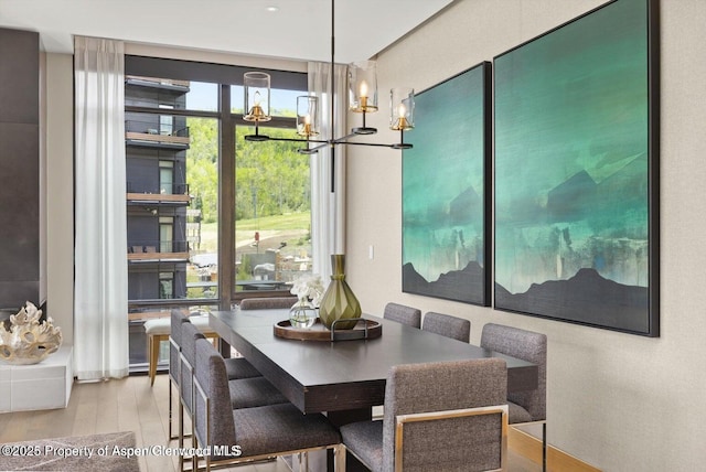 77 Wood Rd Unit 507-10, Snowmass Village, CO 81615 - dining room with wood finished floors and a chandelier