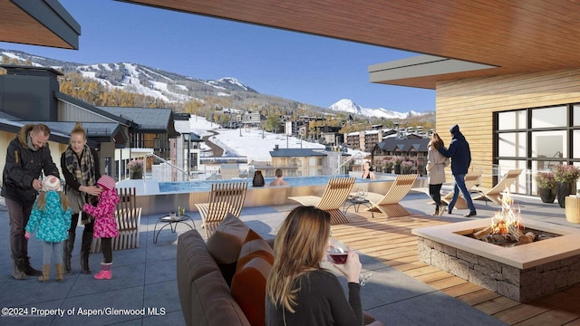 77 Wood Rd Unit 507-10, Snowmass Village, CO 81615 - view of patio featuring a mountain view and a fire pit