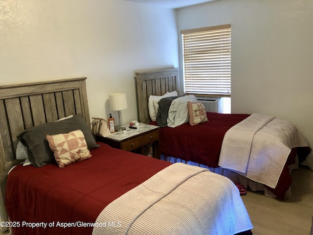 1527 Blake Ave Unit 201, Glenwood Springs, CO 81601 - bedroom with wood finished floors and cooling unit
