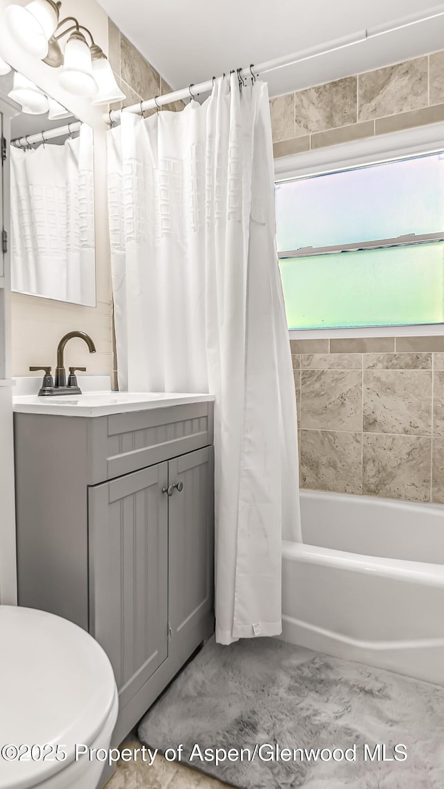 1028 Breeze St, Craig, CO 81625 - bathroom with vanity, shower / bath combo, and toilet