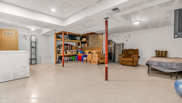 1028 Breeze St, Craig, CO 81625 - finished basement featuring tile patterned floors and refrigerator
