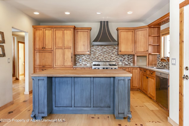 kitchen featuring butcher block counters, black dishwasher, sink, a center island, and range