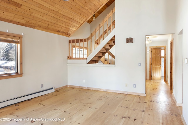 empty room featuring wood ceiling, a baseboard radiator, high vaulted ceiling, and hardwood / wood-style flooring