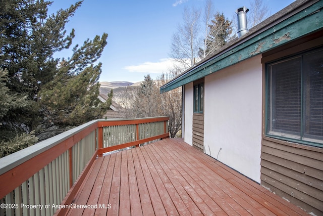 wooden terrace with a mountain view