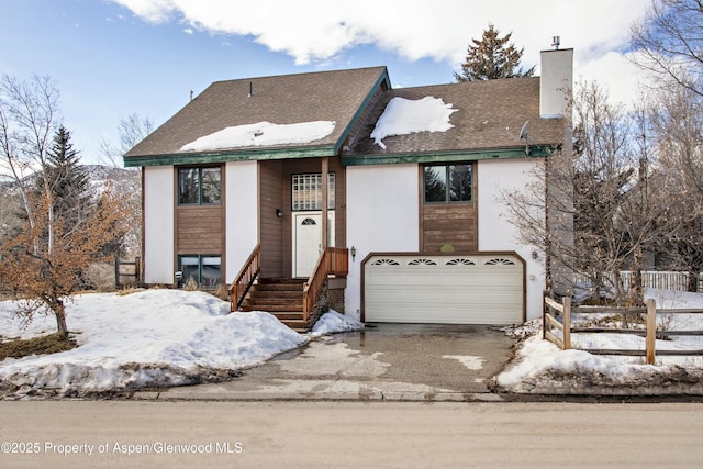 raised ranch featuring a garage