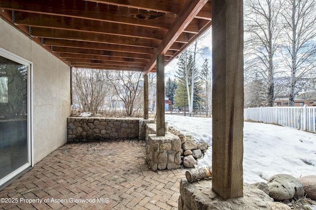 view of snow covered patio