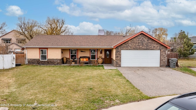1801 Pheasant Cv, Silt, CO 81652 - ranch-style home featuring stone siding, a front yard, driveway, and fence