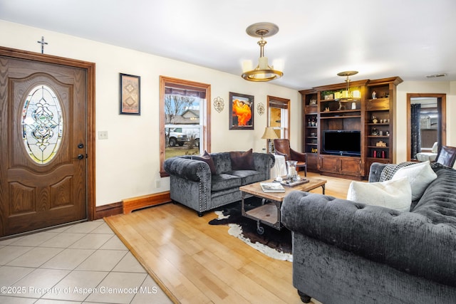 1801 Pheasant Cv, Silt, CO 81652 - living room with light wood-style flooring, baseboards, and visible vents