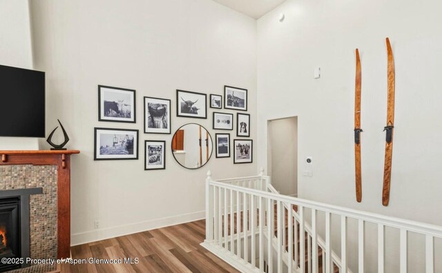 536 Evans Ct, Basalt, CO 81621 - hallway featuring a high ceiling, an upstairs landing, wood finished floors, and baseboards
