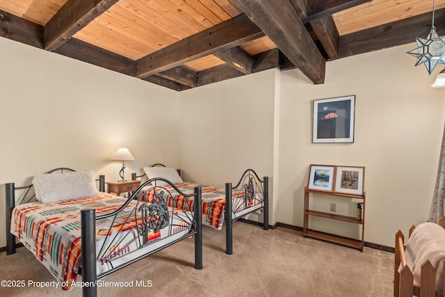 679 Pinon Dr, Basalt, CO 81621 - carpeted bedroom featuring a wood ceiling with exposed beams and baseboards