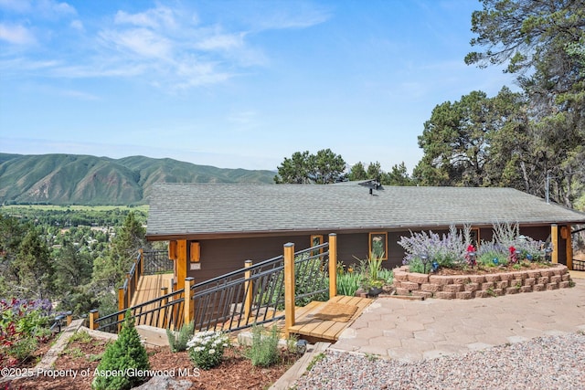679 Pinon Dr, Basalt, CO 81621 - view of front of property with roof with shingles and a deck with mountain view