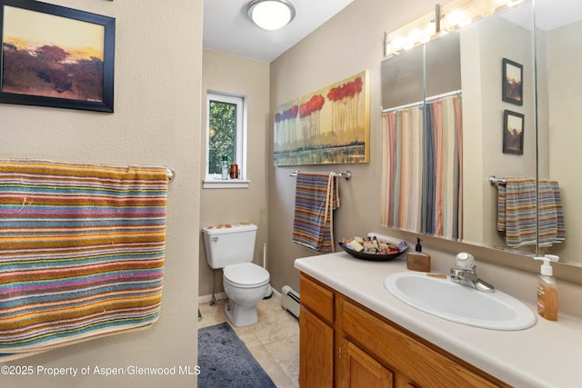 905 Meadow Run, Glenwood Springs, CO 81601 - bathroom with vanity, a baseboard heating unit, and tile patterned floors