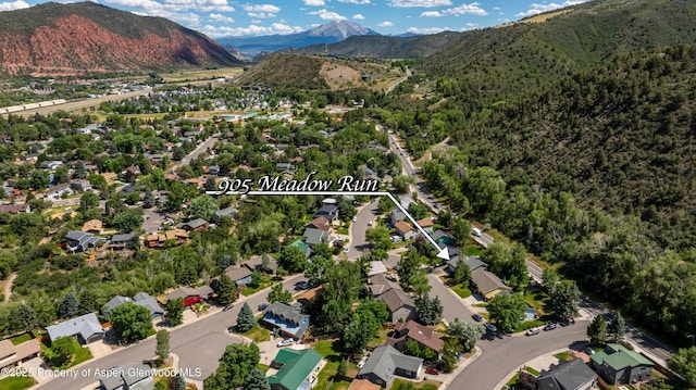 905 Meadow Run, Glenwood Springs, CO 81601 - aerial view of property and surrounding area with a mountainous background and nearby suburban area