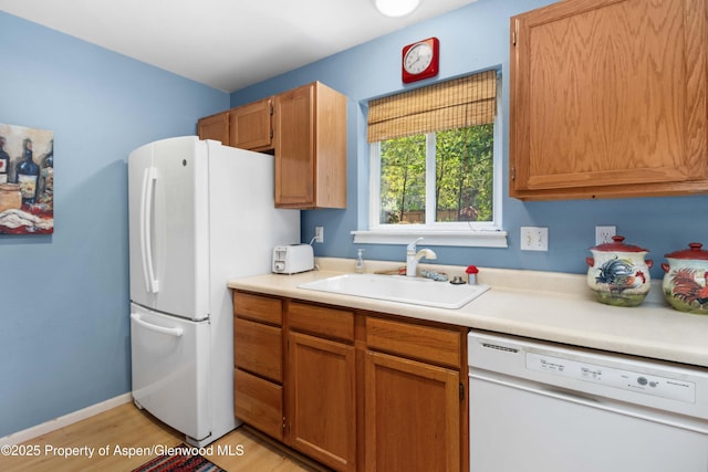 905 Meadow Run, Glenwood Springs, CO 81601 - kitchen with white appliances, light countertops, and light wood-style flooring