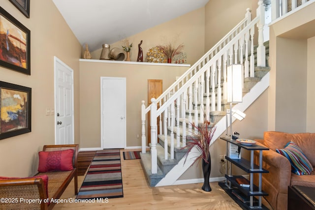 905 Meadow Run, Glenwood Springs, CO 81601 - entrance foyer featuring stairway, wood finished floors, and high vaulted ceiling