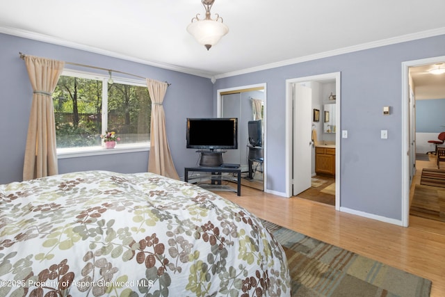 905 Meadow Run, Glenwood Springs, CO 81601 - bedroom featuring wood finished floors, ornamental molding, a closet, and ensuite bathroom