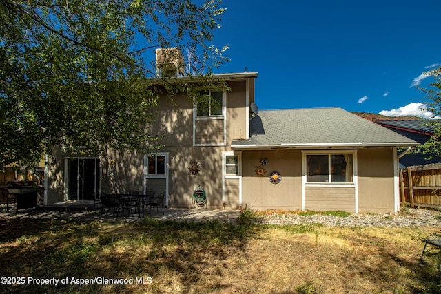 905 Meadow Run, Glenwood Springs, CO 81601 - back of house featuring a patio area and a chimney