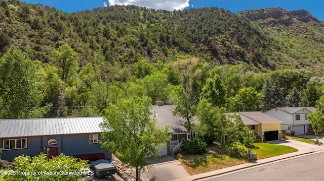 905 Meadow Run, Glenwood Springs, CO 81601 - aerial view of property and surrounding area featuring a forest and mountains