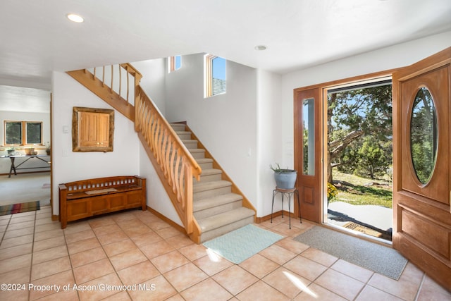 entrance foyer featuring plenty of natural light and light tile patterned floors