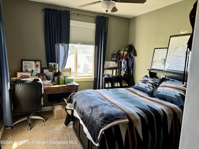 bedroom featuring light carpet and ceiling fan