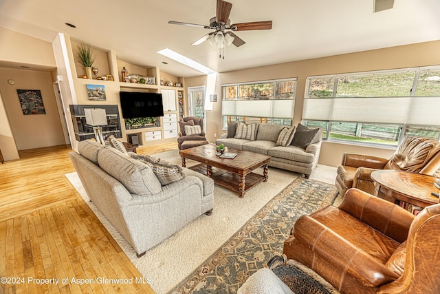 1001 Alta Ct, Craig, CO 81625 - living area with ceiling fan, light wood-style floors, lofted ceiling, and a skylight
