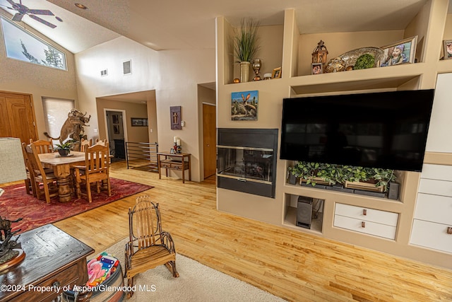 1001 Alta Ct, Craig, CO 81625 - living area with wood finished floors, high vaulted ceiling, and a ceiling fan