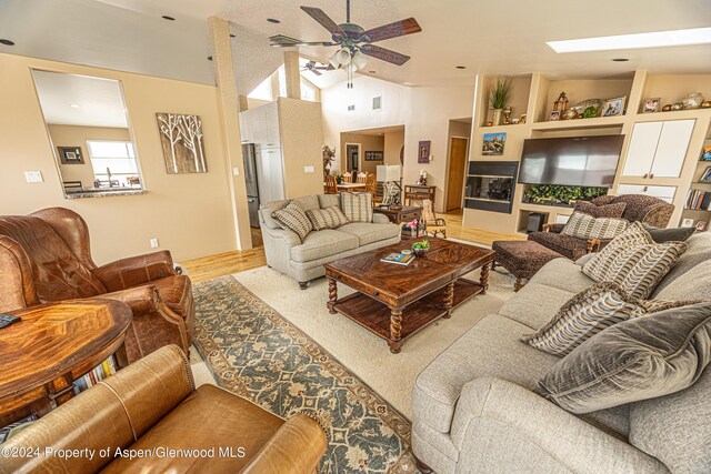 1001 Alta Ct, Craig, CO 81625 - living room featuring a ceiling fan, wood finished floors, and high vaulted ceiling
