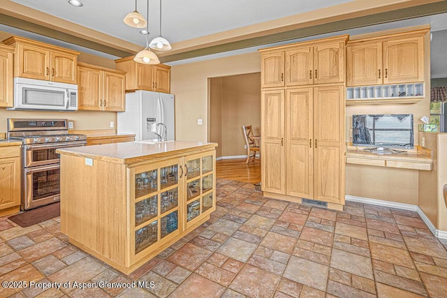 289 Lewis Ln, Craig, CO 81625 - kitchen featuring white appliances, baseboards, light countertops, recessed lighting, and glass insert cabinets