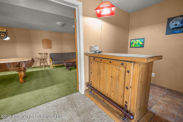 289 Lewis Ln, Craig, CO 81625 - bar area with billiards table, carpet floors, and a textured wall