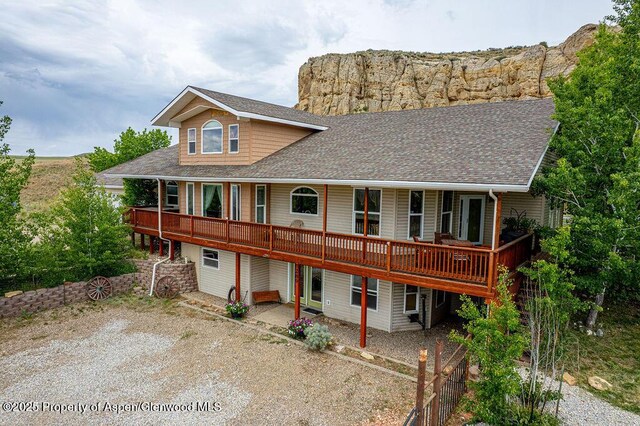 289 Lewis Ln, Craig, CO 81625 - view of front of house with a shingled roof, a patio area, and a deck
