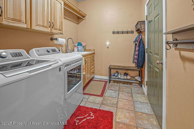 289 Lewis Ln, Craig, CO 81625 - washroom with washer and dryer, cabinet space, light stone finish floors, and baseboards