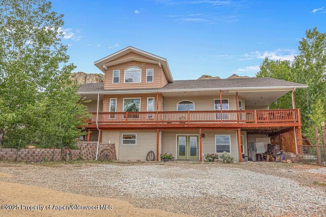289 Lewis Ln, Craig, CO 81625 - rear view of house with french doors, a deck, and roof with shingles