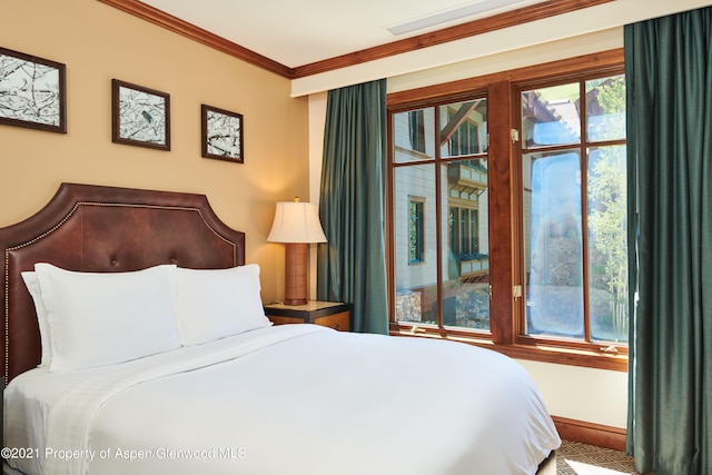 bedroom with crown molding