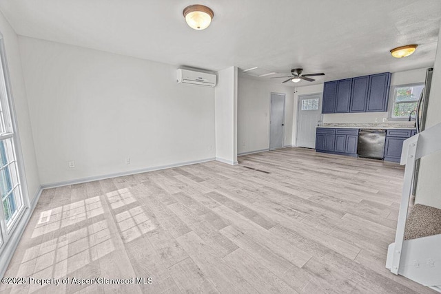 813 Finley Ln, Craig, CO 81625 - unfurnished living room with a wall unit AC, light wood finished floors, and ceiling fan