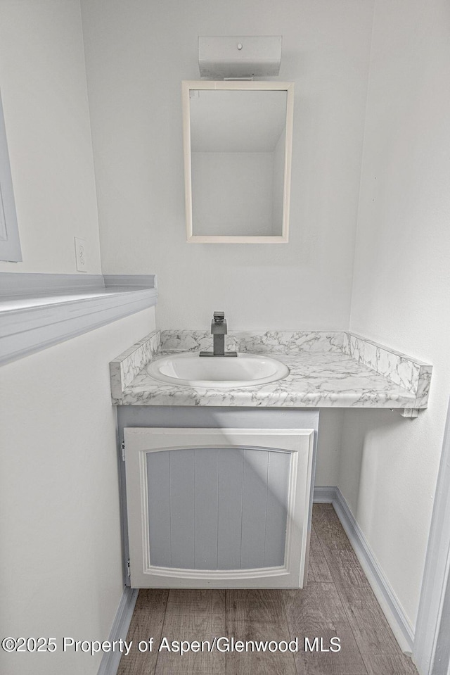 813 Finley Ln, Craig, CO 81625 - bathroom featuring wood finished floors and vanity