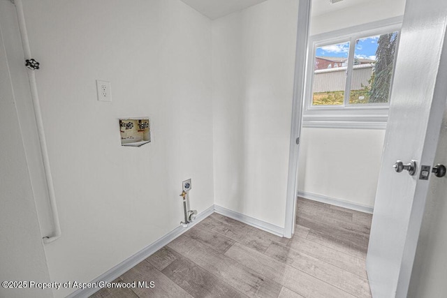 813 Finley Ln, Craig, CO 81625 - laundry room featuring hookup for an electric dryer, hookup for a washing machine, and wood finished floors