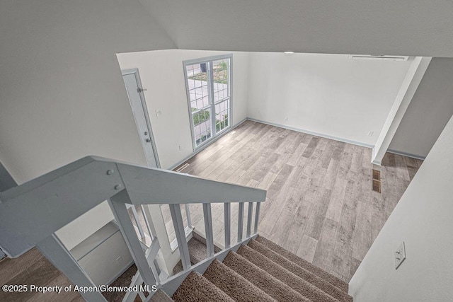 813 Finley Ln, Craig, CO 81625 - staircase with wood finished floors and vaulted ceiling