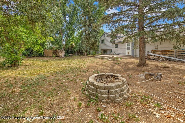 813 Finley Ln, Craig, CO 81625 - view of yard featuring an outdoor fire pit and a patio