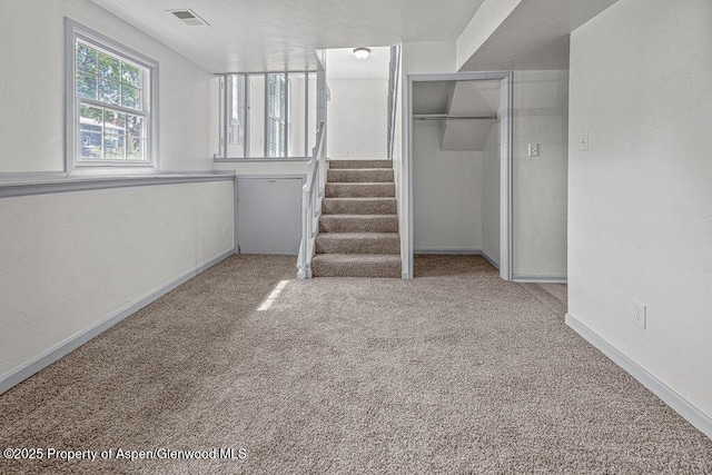 813 Finley Ln, Craig, CO 81625 - below grade area featuring carpet floors and stairway