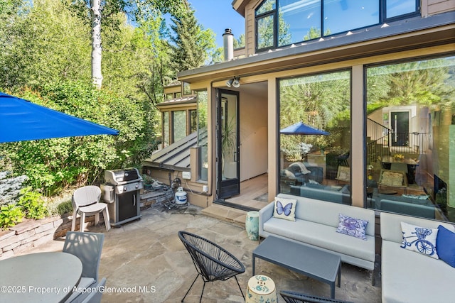 155 Lone Pine Rd Unit 2, Aspen, CO 81611 - view of patio featuring a grill, a sunroom, and an outdoor living space
