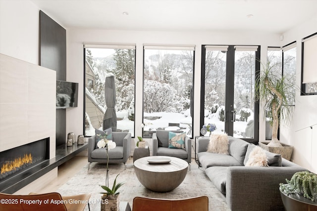155 Lone Pine Rd Unit 2, Aspen, CO 81611 - living area featuring a tile fireplace and wood finished floors