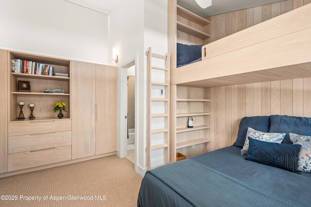 155 Lone Pine Rd Unit 2, Aspen, CO 81611 - bedroom with light carpet and wooden walls
